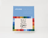 2026 Calendar with motivational quote with clear easel display on a white background