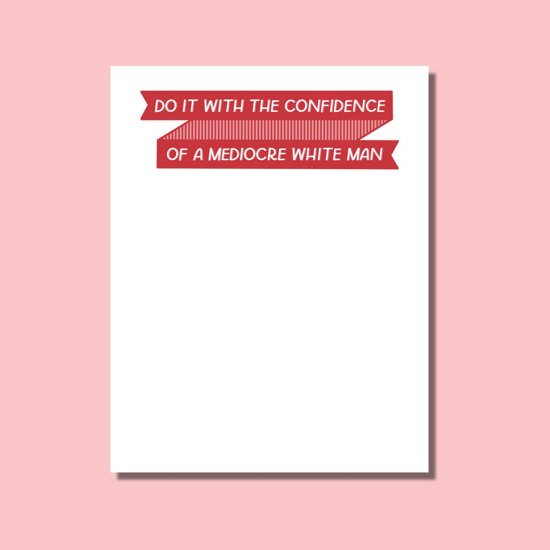 Notepad with humorous feminist quote on a pink background