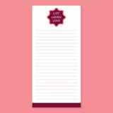 Notepad with a label saying 'List Laugh Love' on a pink background