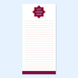 Notepad with a red label reading 'List Laugh Love' on a light blue background
