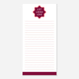 Notepad with a red label reading 'List Laugh Love' on a white background